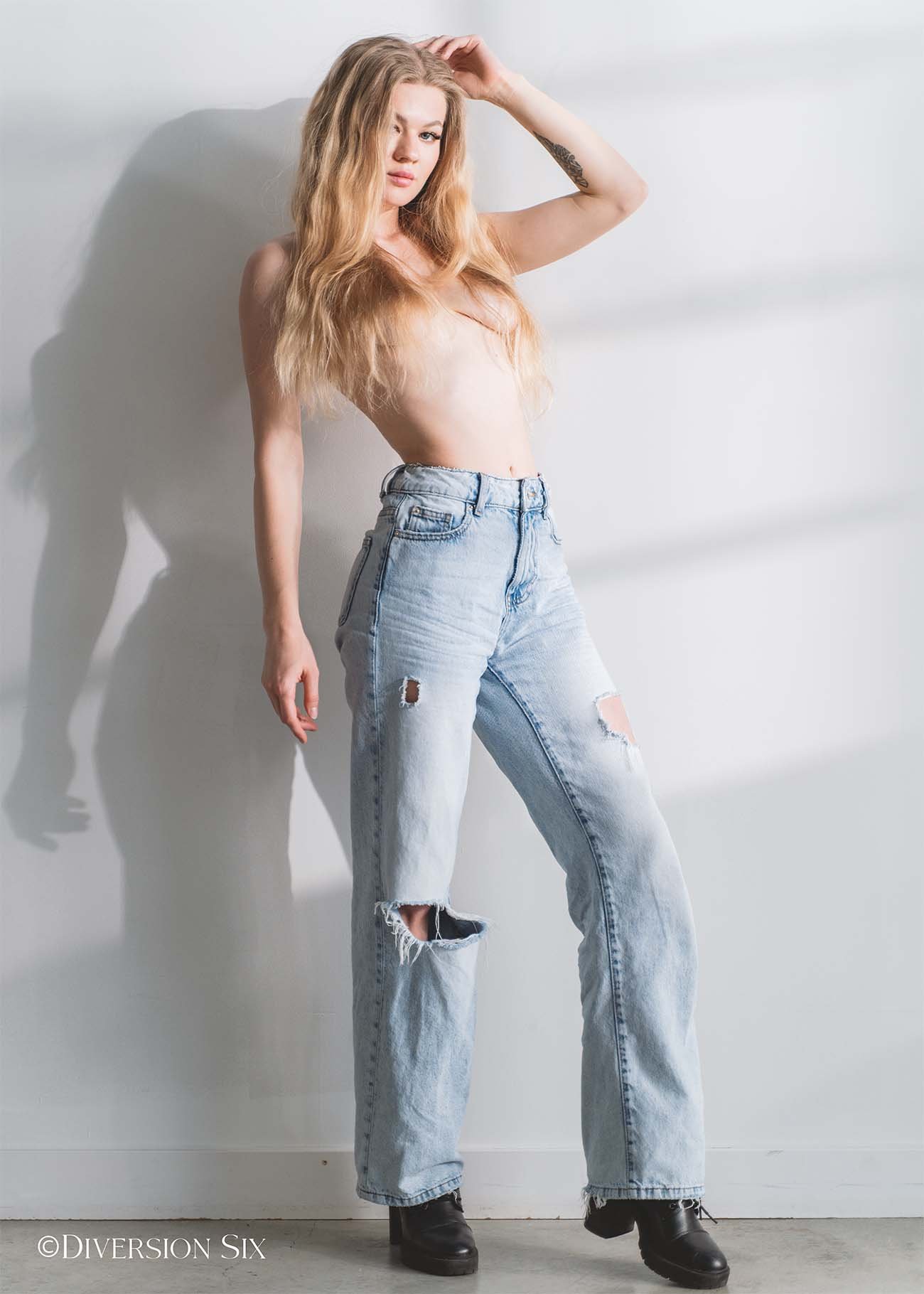 Topless blonde women wearing jeans