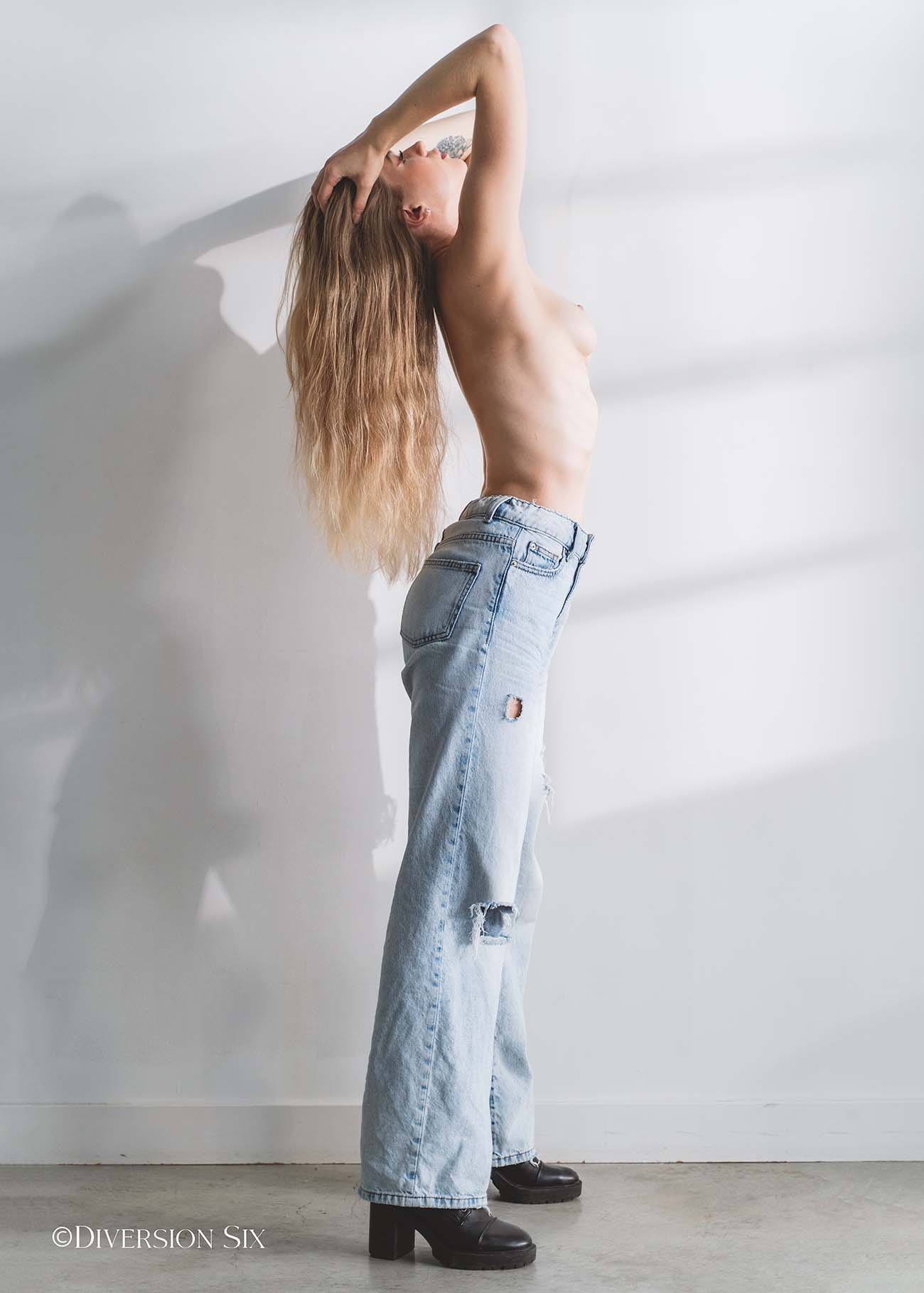 Sexy topless blonde babe  wearing jeans