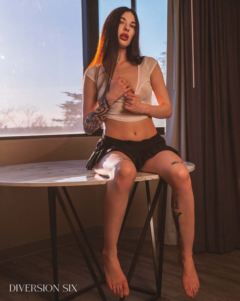 Erotic model Gera in a sexy skirt and sheer crop top